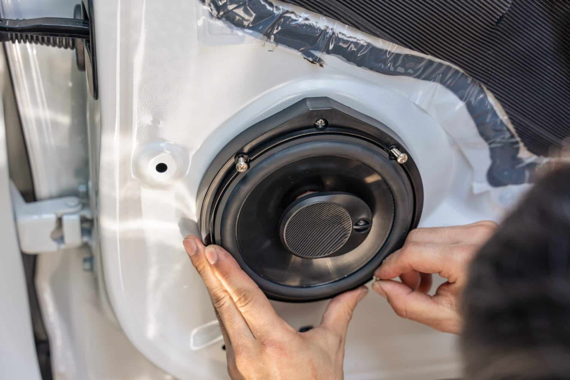 mechanic man installing speaker on vehicle door pa 2025 03 25 18 25 10 utc scaled