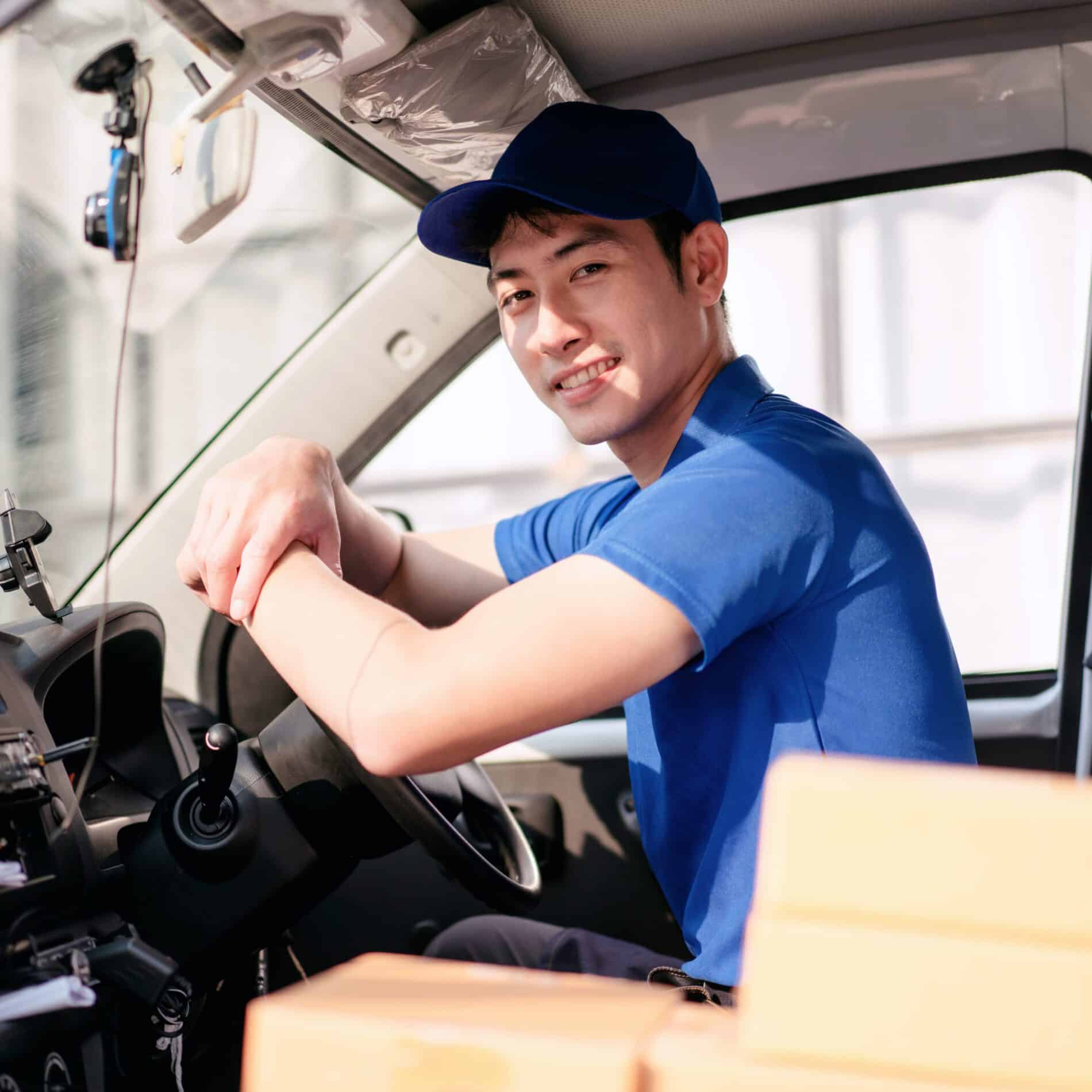 a man in a blue shirt is driving a truck 2024 10 14 22 17 09 utc scaled