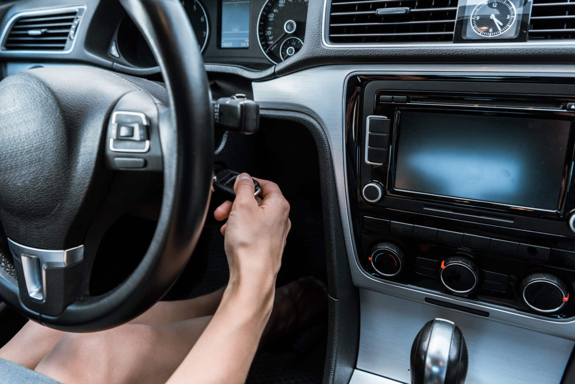 cropped view of woman putting car key in keyhole w 2024 11 19 18 23 52 utc scaled