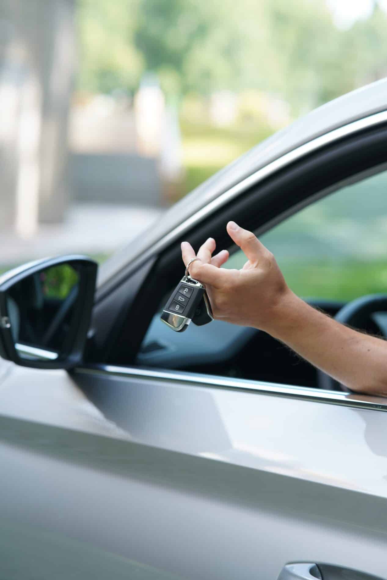 man driver holding car keys of new car sitting ins 2025 01 07 23 09 07 utc scaled